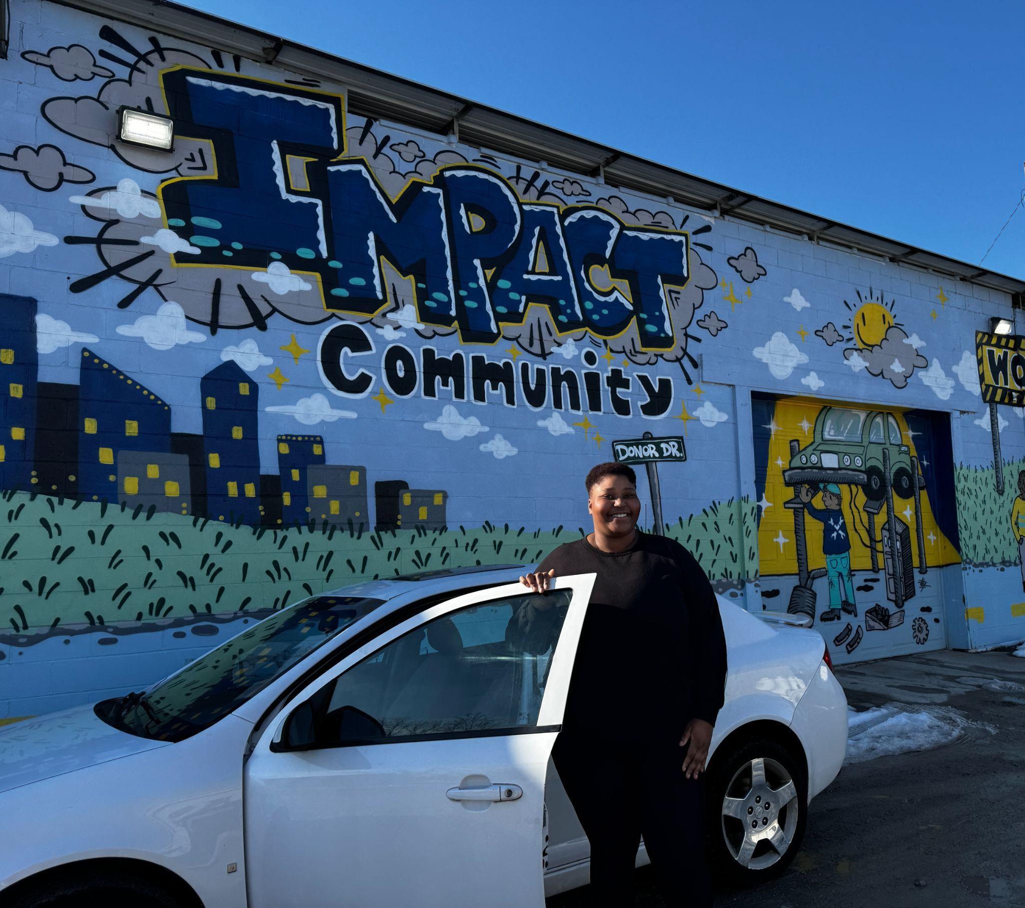 Britney with her vehicle at Impact Garage